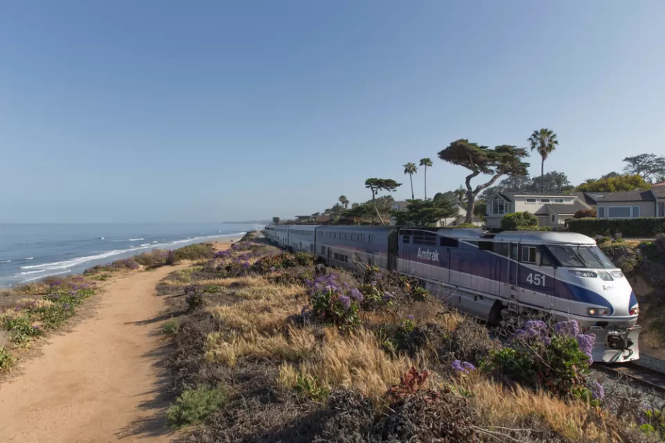 Amtrak train on track by the beach in Souhern California